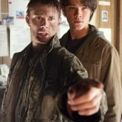 From Supernatural's pilot: Sam and muddy Dean check out their father's motel room.